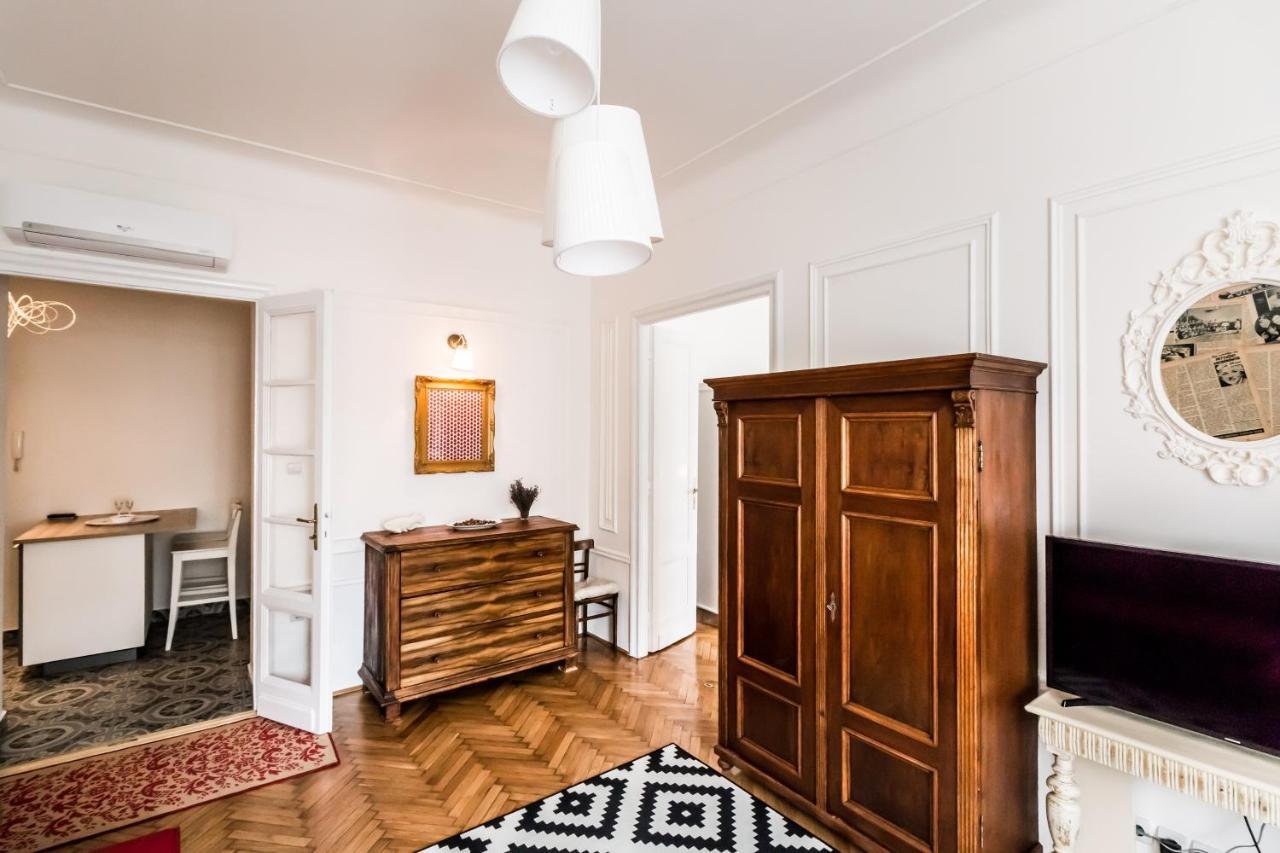 Golden Esthetic with Red Sofa Apartment 1