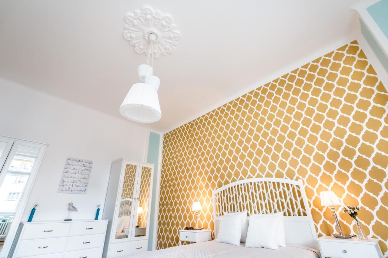 Golden Esthetic with Red Sofa Apartment 2